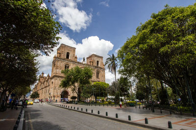 Panoramic view of trees and buildings against sky