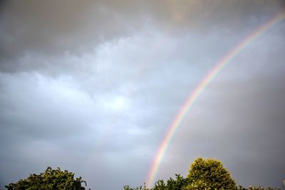 Low angle view of rainbow against sky