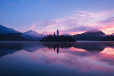 Scenic view of lake against sky during sunset