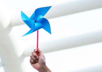 Close-up of hand holding pinwheel toy