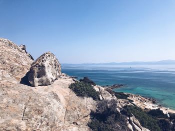 Scenic view of sea against clear blue sky