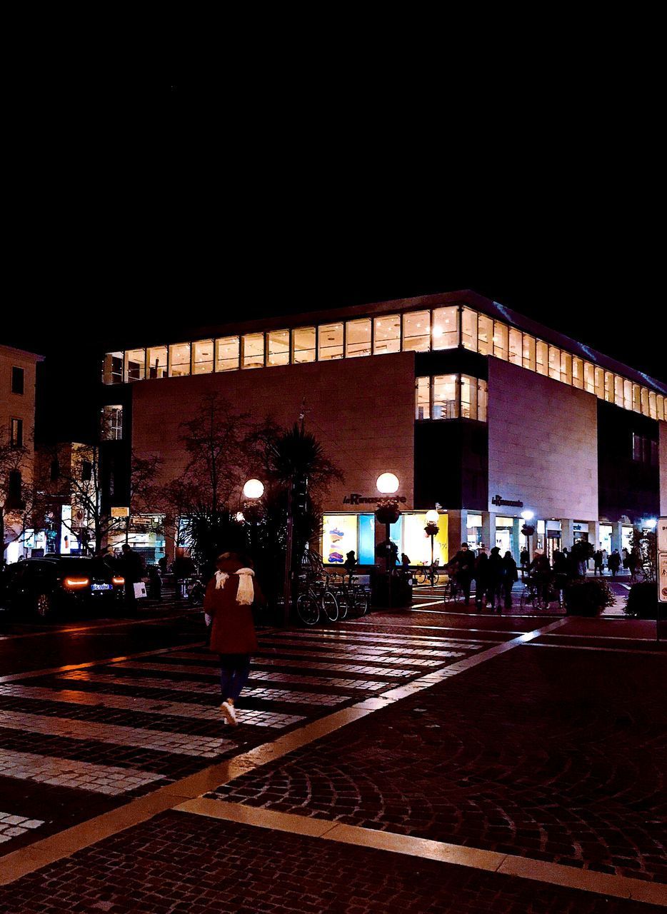 ILLUMINATED RAILROAD STATION AT NIGHT