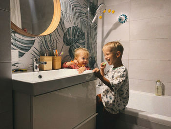 Children in the bathroom brushing their teeth