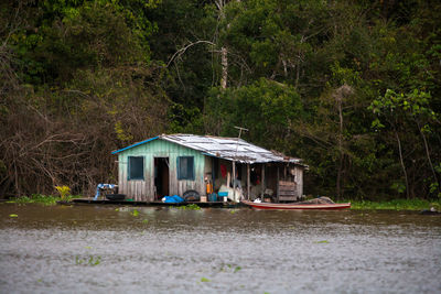 House by lake in forest