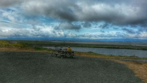 Scenic view of sea against cloudy sky