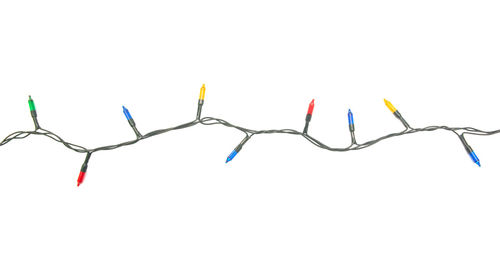 Close-up of multi colored pencils against white background