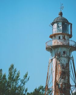 Low angle view of lighthouse against clear blue sky