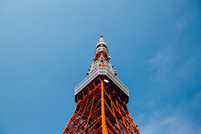 Low angle view of tower against blue sky