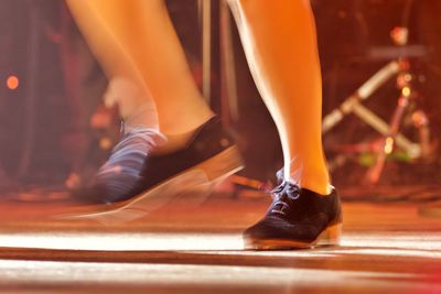 Low section of man and woman standing on floor