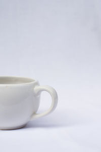 Close-up of coffee cup against white background