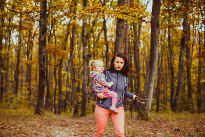 Woman standing in forest