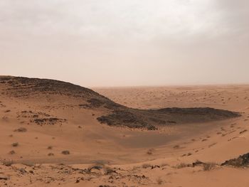 Scenic view of desert against sky