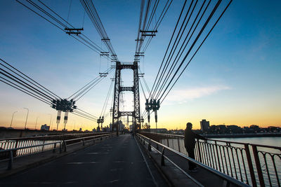 Low angle view of bridge against sky during sunset