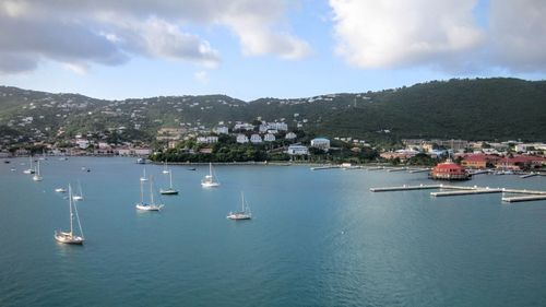 High angle view of sailboats in sea against sky