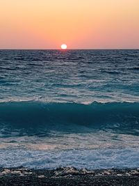 Scenic view of sea against clear sky during sunset