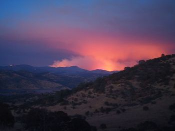 Scenic view of silhouette mountains against sky during sunset
