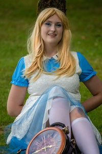 Portrait of smiling young woman in field