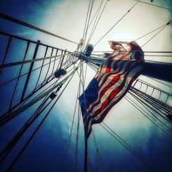 Low angle view of flag against sky