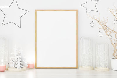 Close-up of empty table against white wall at home