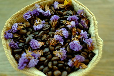 Close-up of purple flowers in basket