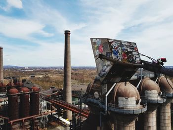 Abandoned factory against sky