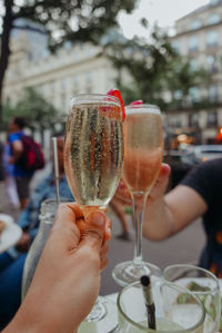 Cropped image of friends toasting champagne flutes