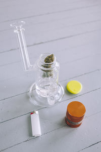 High angle view of bottles in jar on table