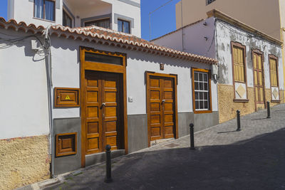 Houses by street in city