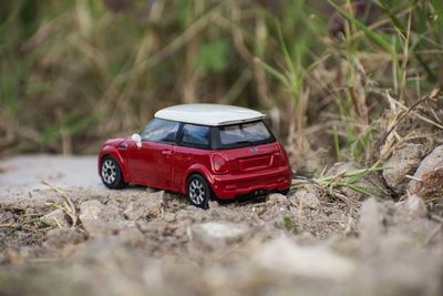 Close-up of toy car on dirt