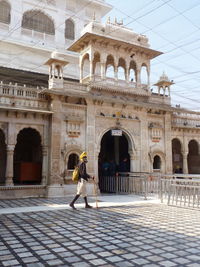 Woman walking in historical building