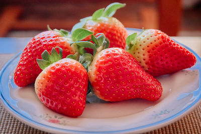 Close-up of strawberries in plate on table