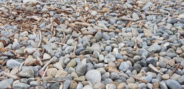 High angle view of stones on pebbles
