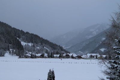 Scenic view of snow covered mountains