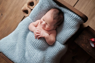 High angle view of baby on bed