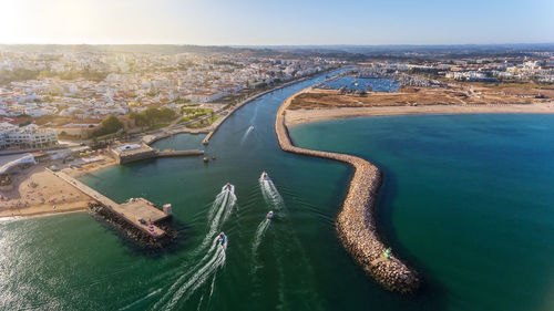 High angle view of city by sea