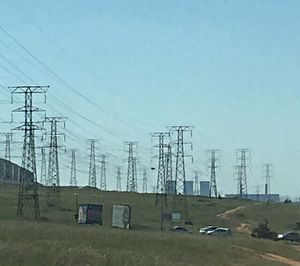 Electricity pylon against clear sky