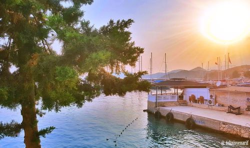 Scenic view of lake against sky at sunset