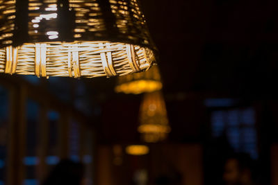 Low angle view of illuminated lighting equipment