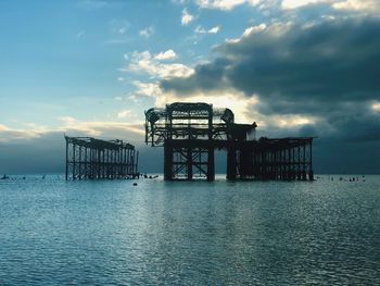 Pier over sea against sky