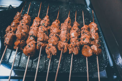 High angle view of meat on barbecue grill