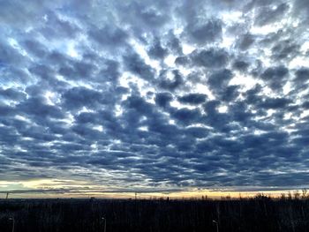 Scenic view of dramatic sky over land