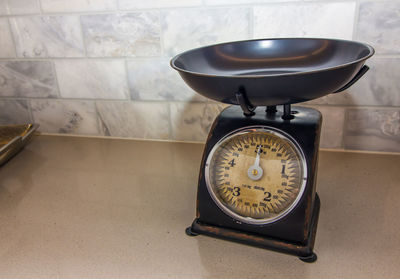 High angle view of clock on table