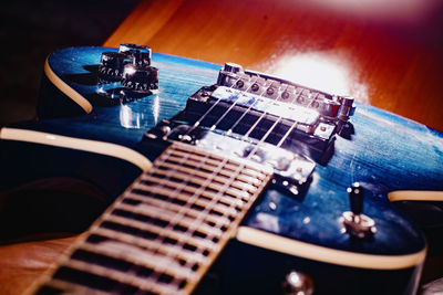 Close-up of guitar on table