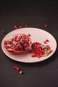 High angle view of strawberries in plate on table