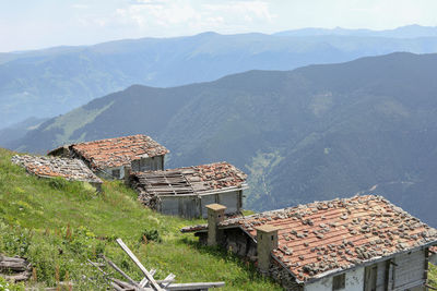 High angle view of houses on mountain against sky