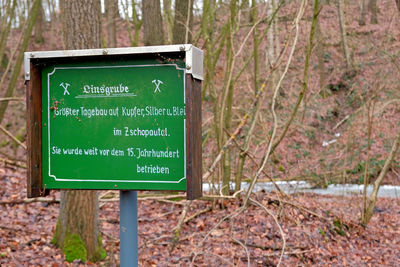 Information sign on tree trunk