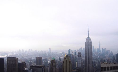 Modern buildings in city against sky