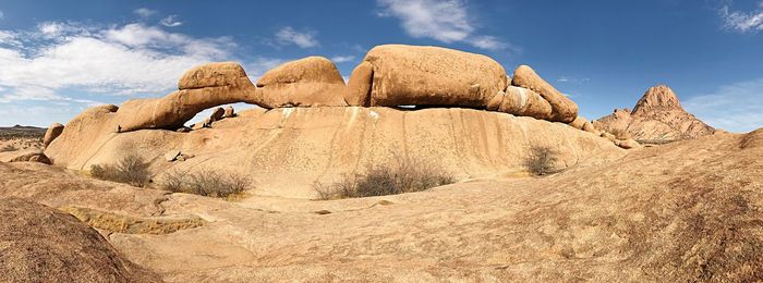 Panoramic view of rock formations against sky