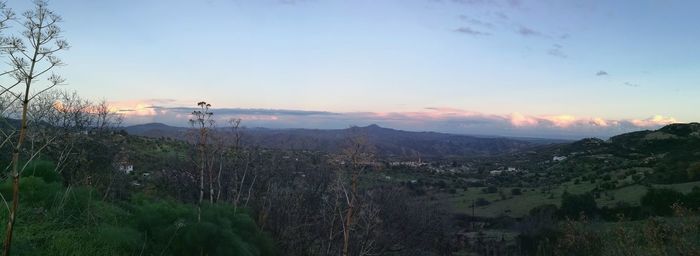 Scenic view of landscape against sky during sunset