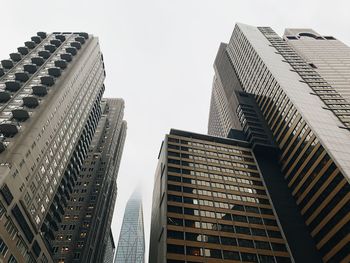 Low angle view of modern buildings against sky in city